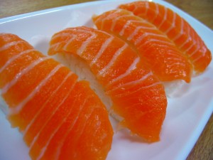 "Salmon nigiri" by Peterjhpark at en.wikipedia; transferred from en.wikipedia; transferred to Commons by User:Kelly using CommonsHelper.(Original text : self-made). Licensed under CC BY-SA 3.0 via Wikimedia Commons.
