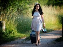 woman walking with suitcase